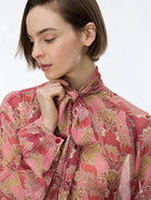 Close-up of iBlues Iblsecolo pink floral blouse with oversized tie neck