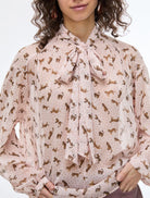 Close-up of iBlues Iblsecolo dressy leopard print top with oversized bow