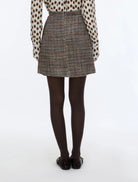 Back view of iBlues Iblundici brown check tweed mini skirt
