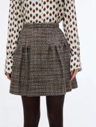 Close-up of iBlues Iblundici brown check tweed mini skirt with front darts