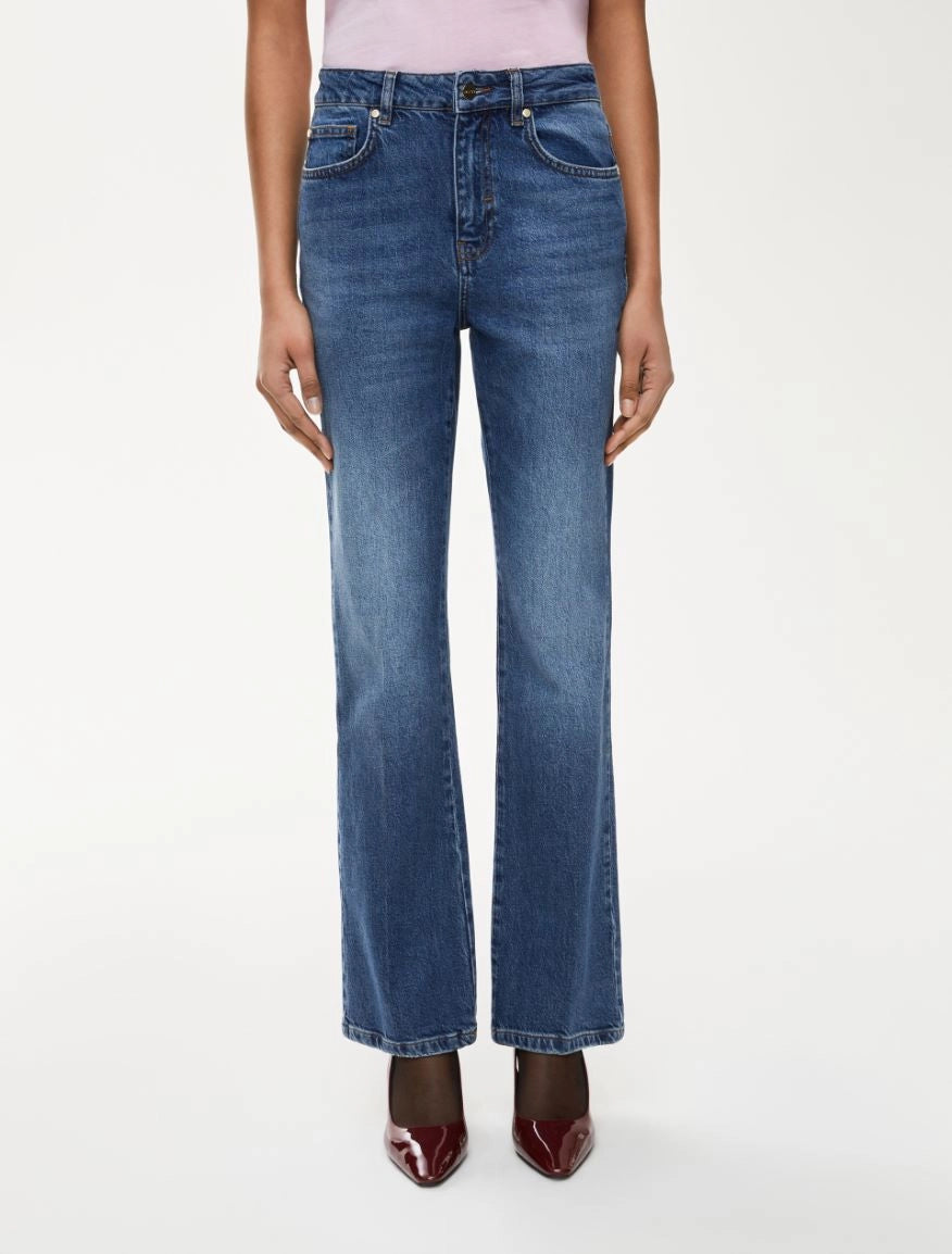 Front view of women’s mid-rise straight leg blue jeans