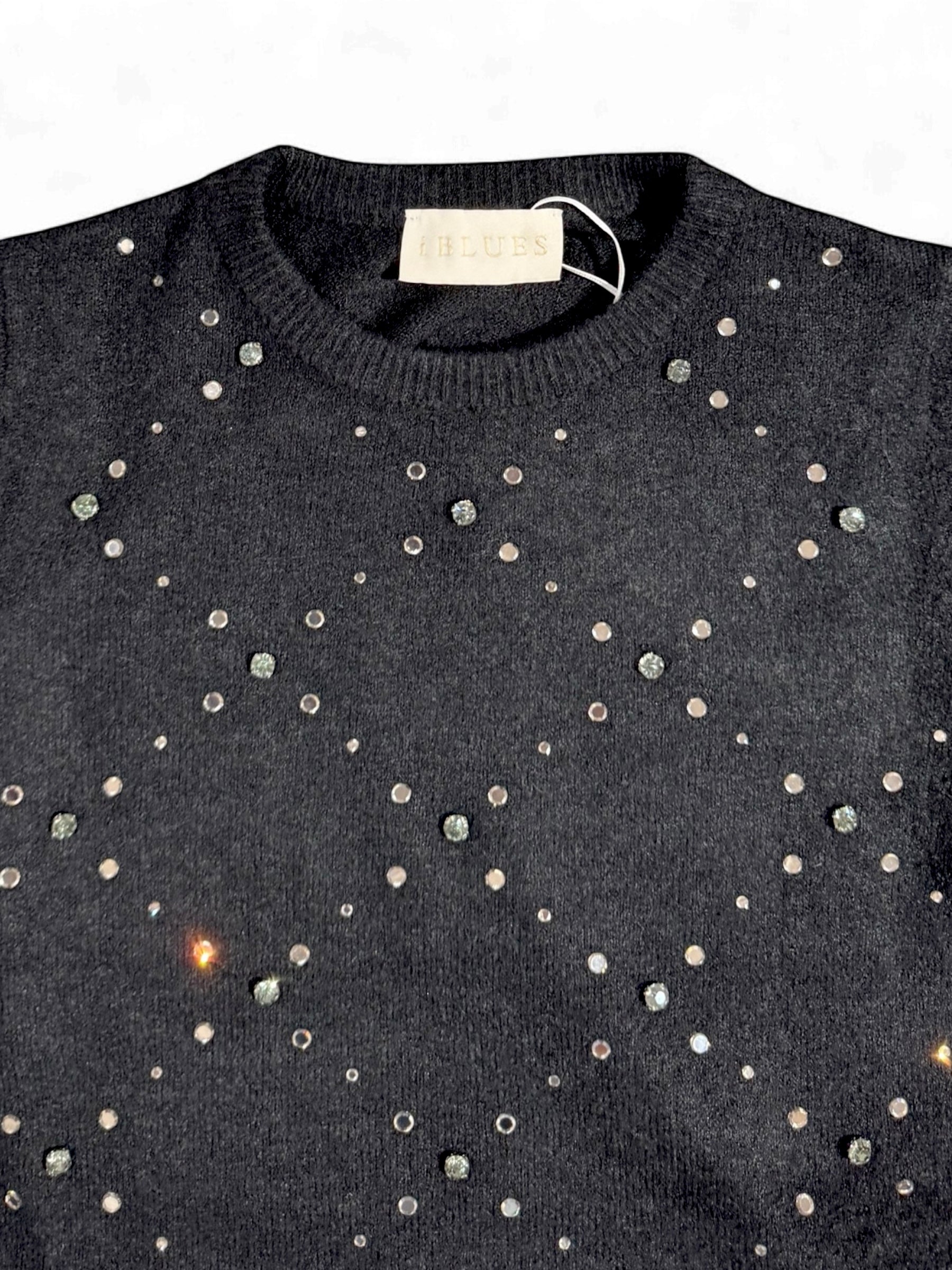 Close-up of iBlues Luciana jumper showing lattice stud motif and neckline