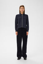 Front view of InWear navy jersey jacket styled with dark trousers