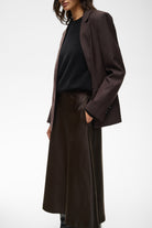 Side view of InWear Zilky flowing brown satin skirt