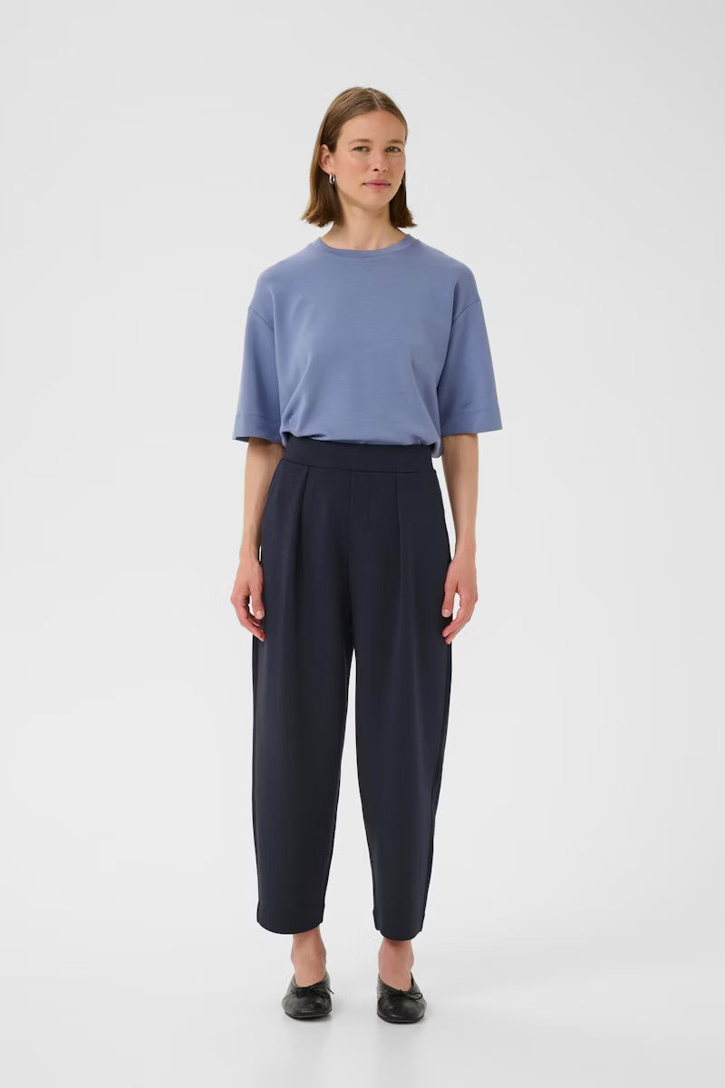 Front view of InWear PannieI navy relaxed fit trousers styled with blue top