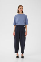 Front view of InWear PannieI navy relaxed fit trousers styled with blue top