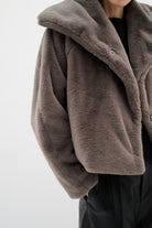 Model wearing InWear faux fur jacket with draped collar