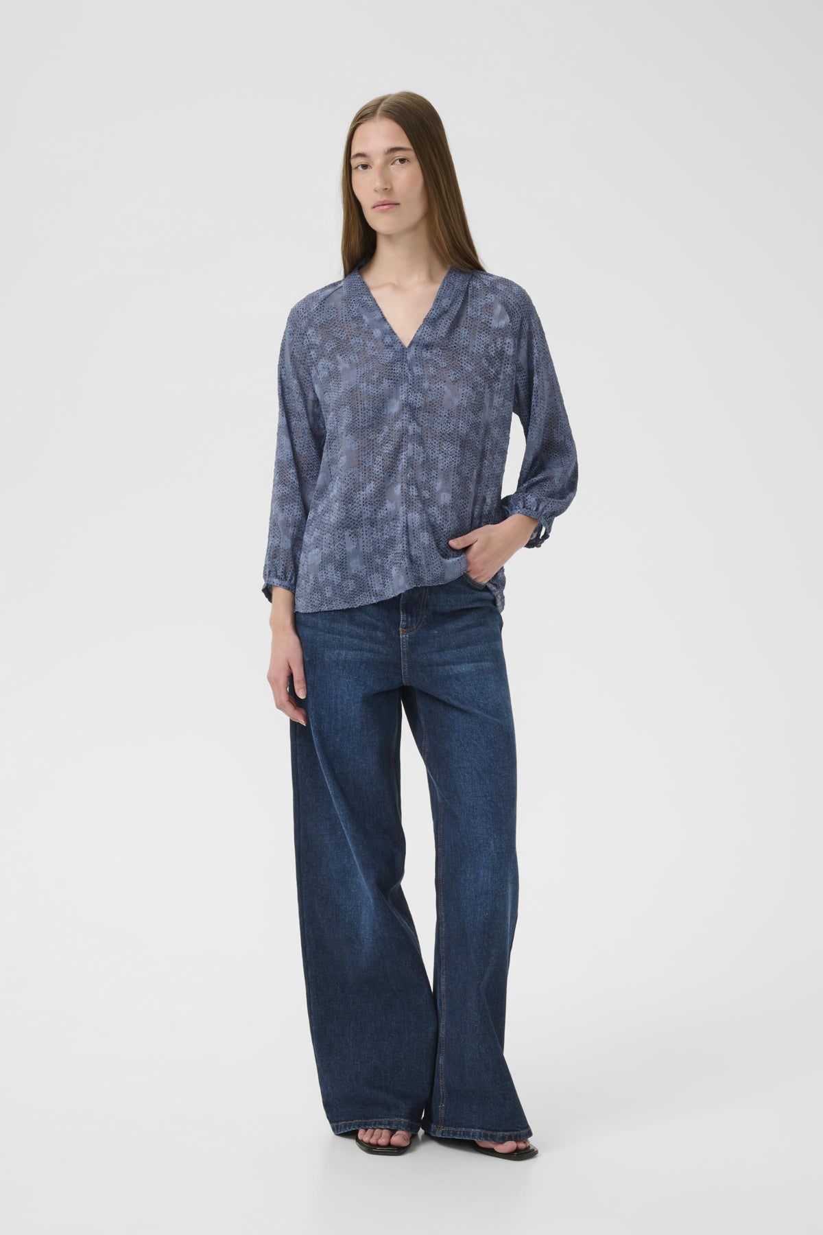 Inwear AddisonIW Blue Dot Print Blouse on middle aged woman, full-length front shot paired with denim.
