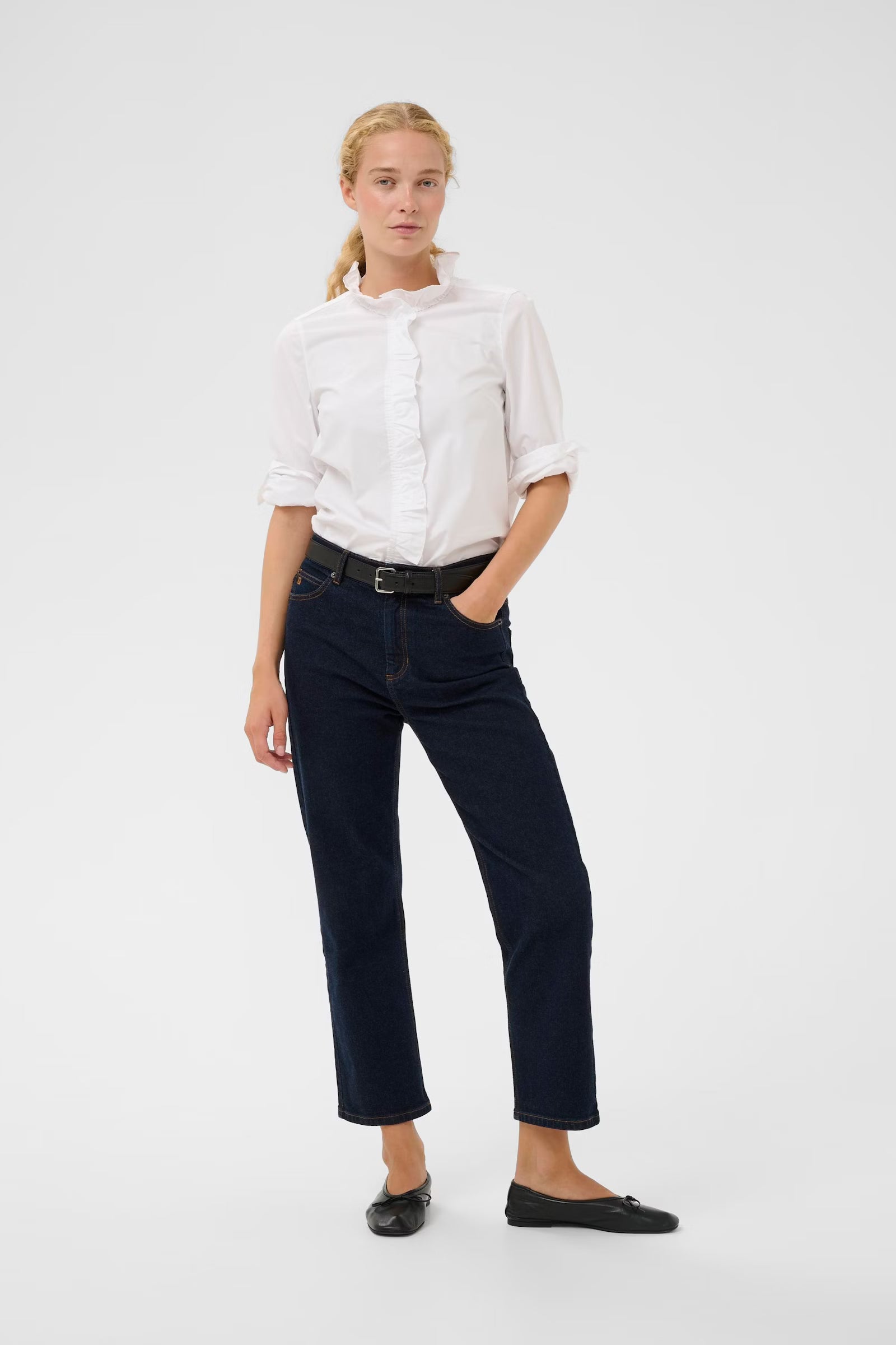 Model wearing InWear white frill shirt with dark straight-leg jeans