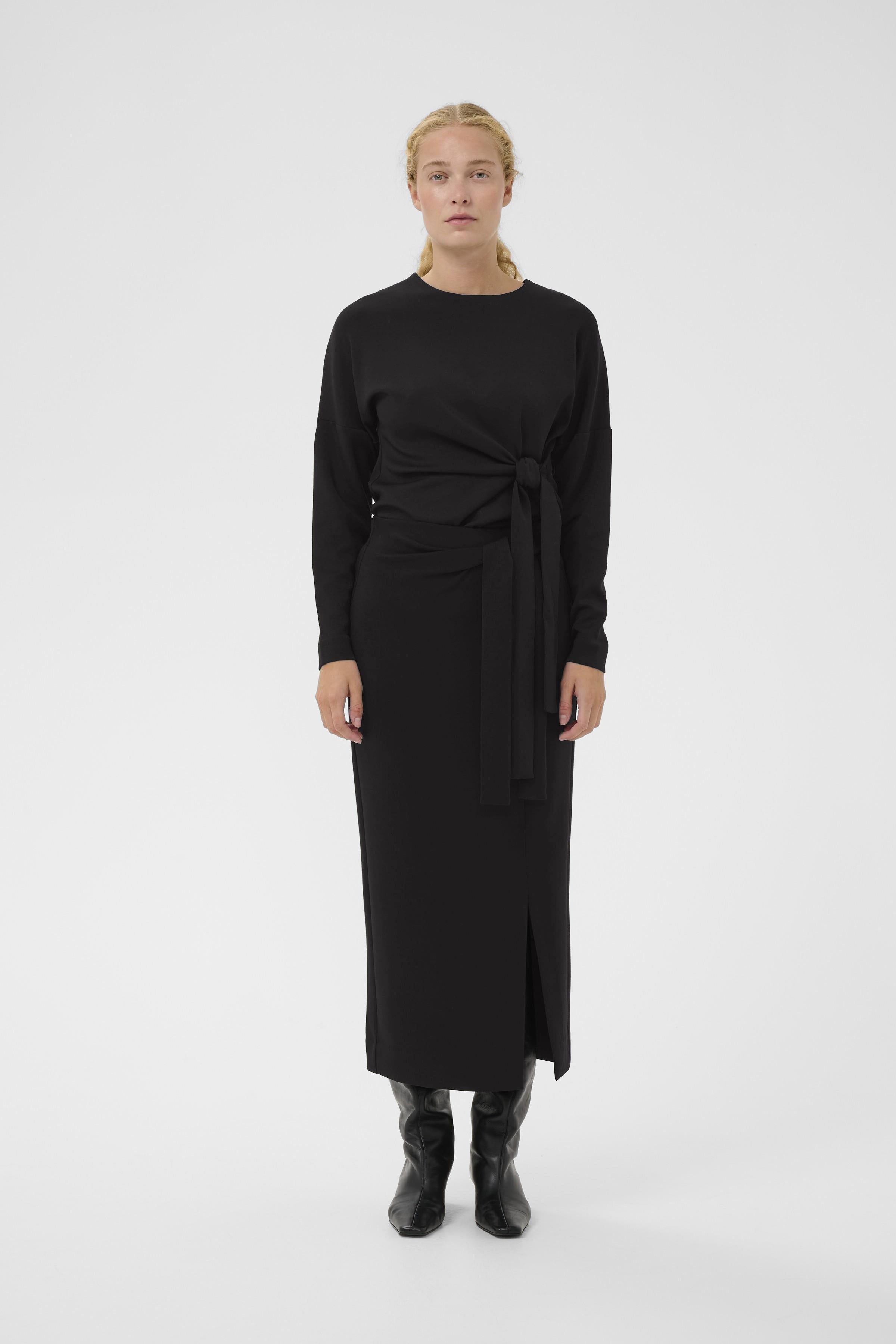 Model wearing InWear Tricenti top and matching matching black skirt