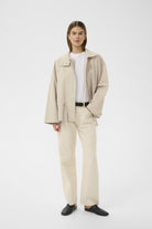 InWear Grace Lynn boxy loose fit jacket styled open over white top and trousers
