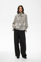InWear Gracie cream printed blouse styled with black tailored trousers