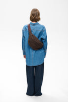  InWear Rasida brown suede crossbody bag worn across the back