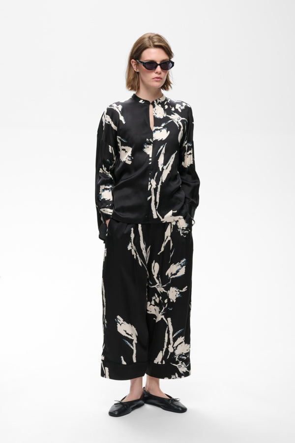 InWear Meadow black floral blouse side view with wide-leg trousers