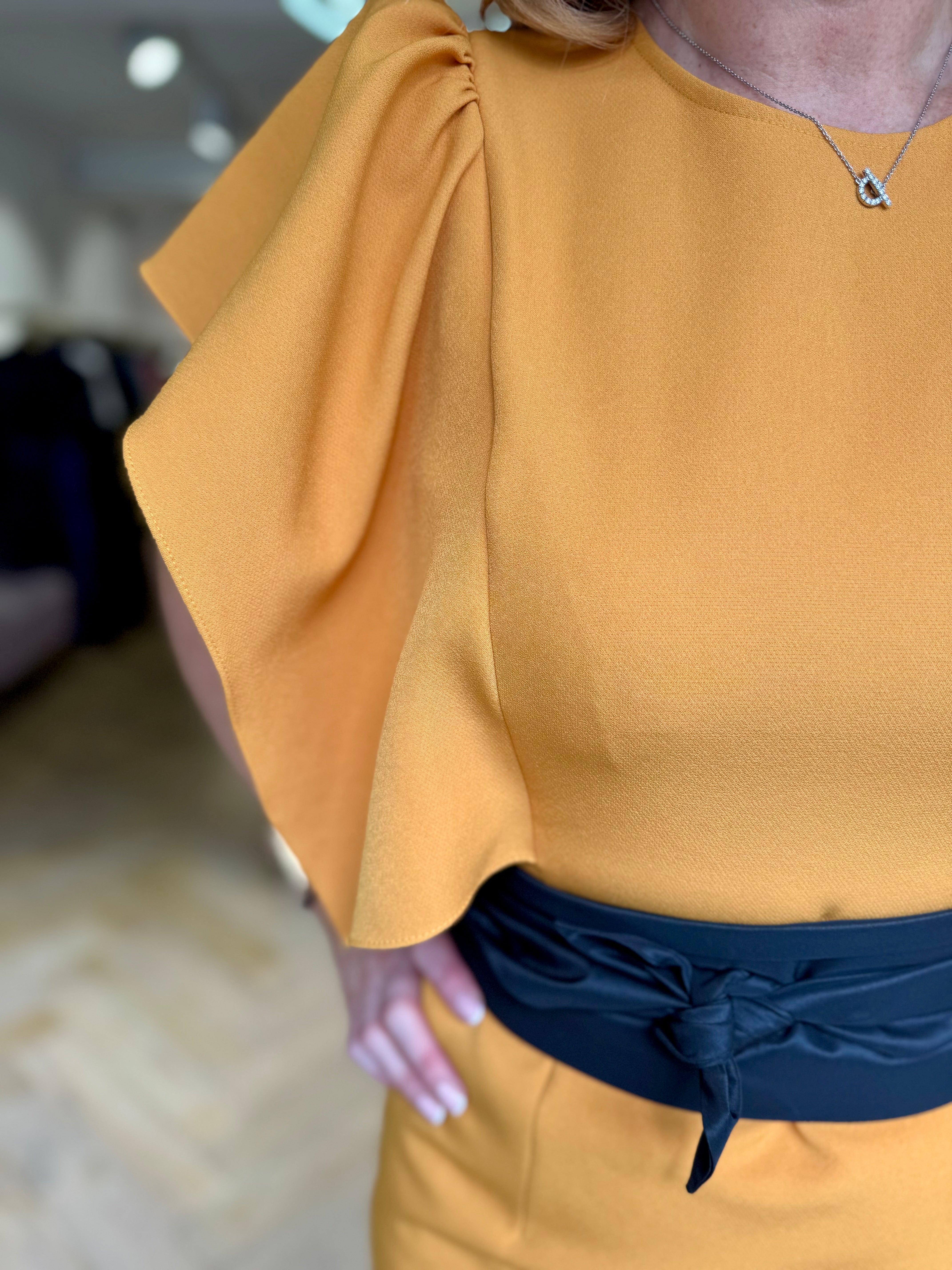 Kameya mustard floaty sleeve dress with black waist belt – close-up front detail