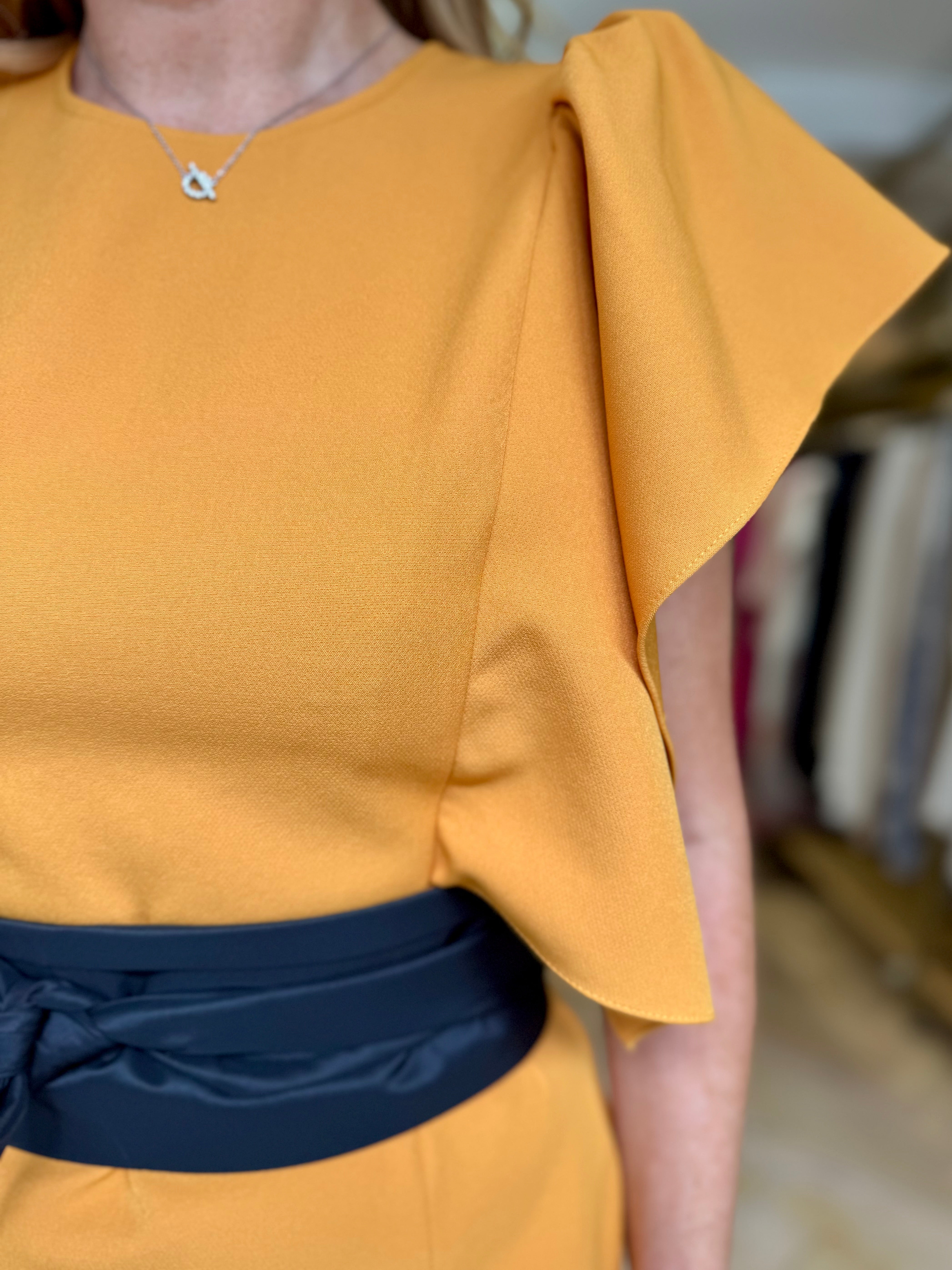 Kameya mustard midi dress with structured sleeves – close-up neckline and belt