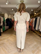 Rear boutique view of Kameya Draped Shoulder Midi Dress with centre back slit
