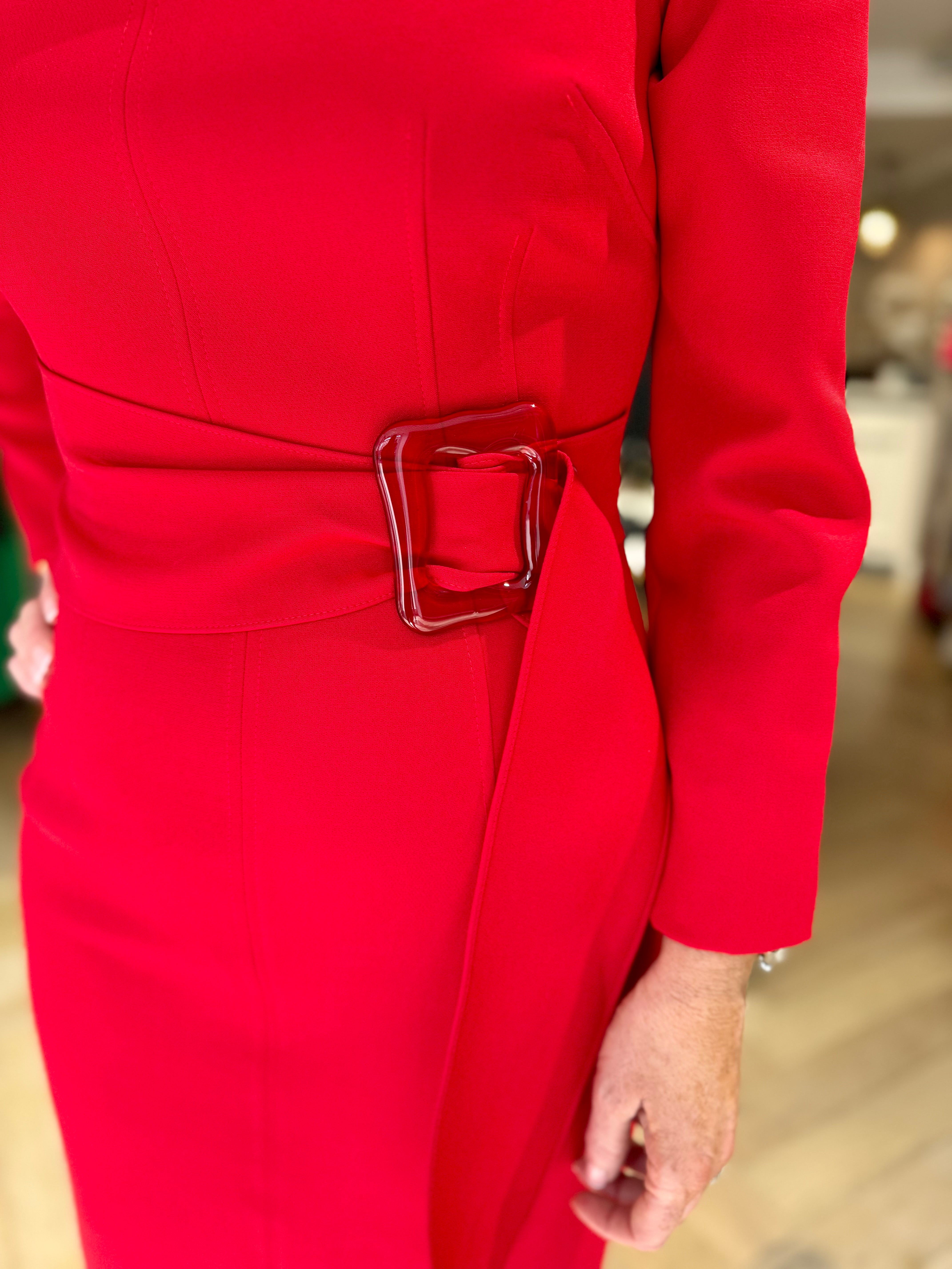 	Close-up of waist and belt detail on Kameya red belted slit neckline dress