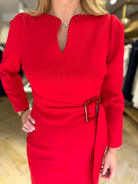 Boutique fitting of Kameya red belted dress with long sleeves and structured waist
