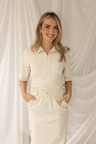 Kimara Maggie zip front stretch top short sleeve beige