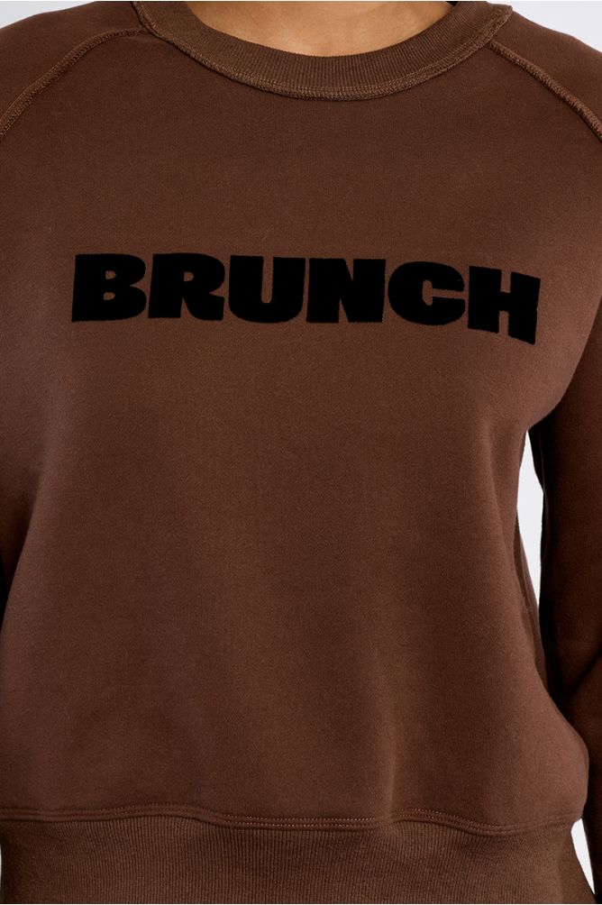 Lili Sidonio brown sweatshirt black Brunch slogan detail close-up