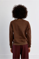 Lili Sidonio brown oversized slogan sweatshirt back view