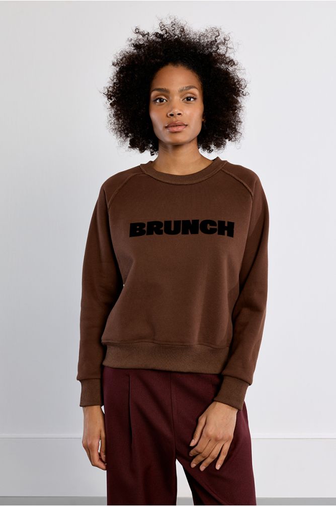 Lili Sidonio Brunch crew neck sweatshirt styled with burgundy trousers