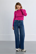 Lili Sidonio women’s dark blue wide leg jeans styled with pink knit