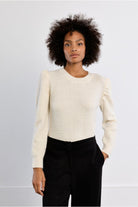 Lili Sidonio cream knitted jumper styled with black trousers