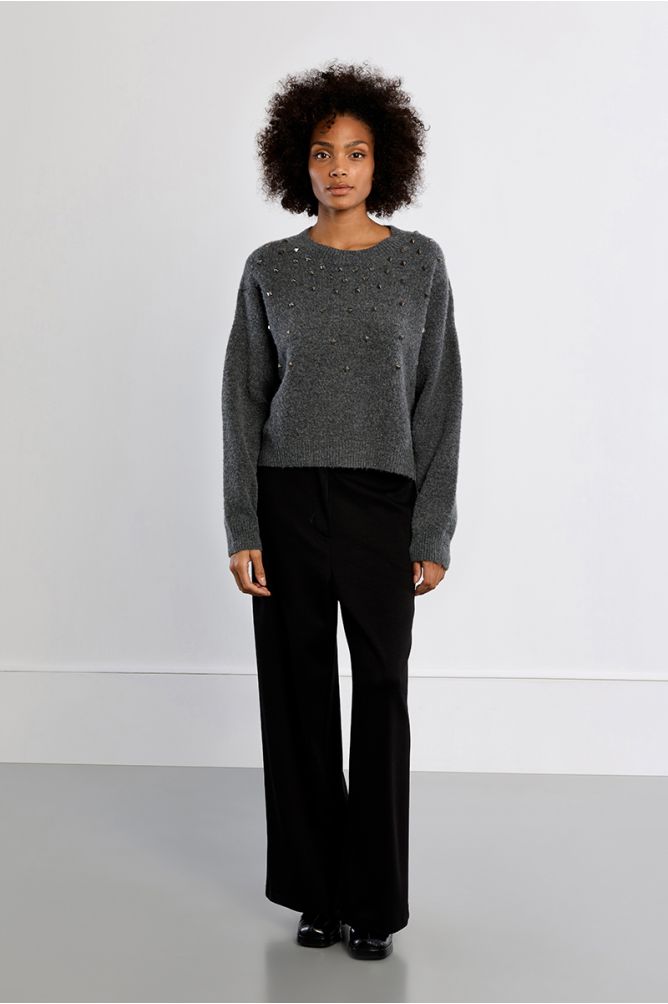 Lili Sidonio grey embellished knit jumper styled with black trousers