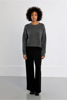 Lili Sidonio grey embellished knit jumper styled with black trousers