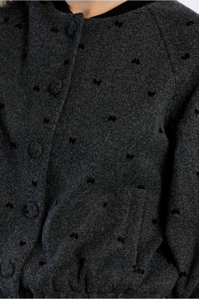 Lili Sidonio dark grey tweed jacket black bow detail close-up