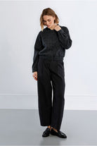 Lili Sidonio bow detail bomber jacket styled with black trousers