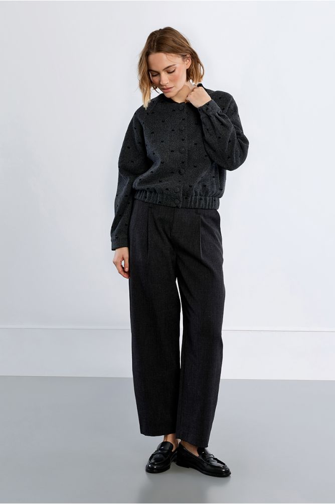 Lili Sidonio bow detail bomber jacket styled with black trousers