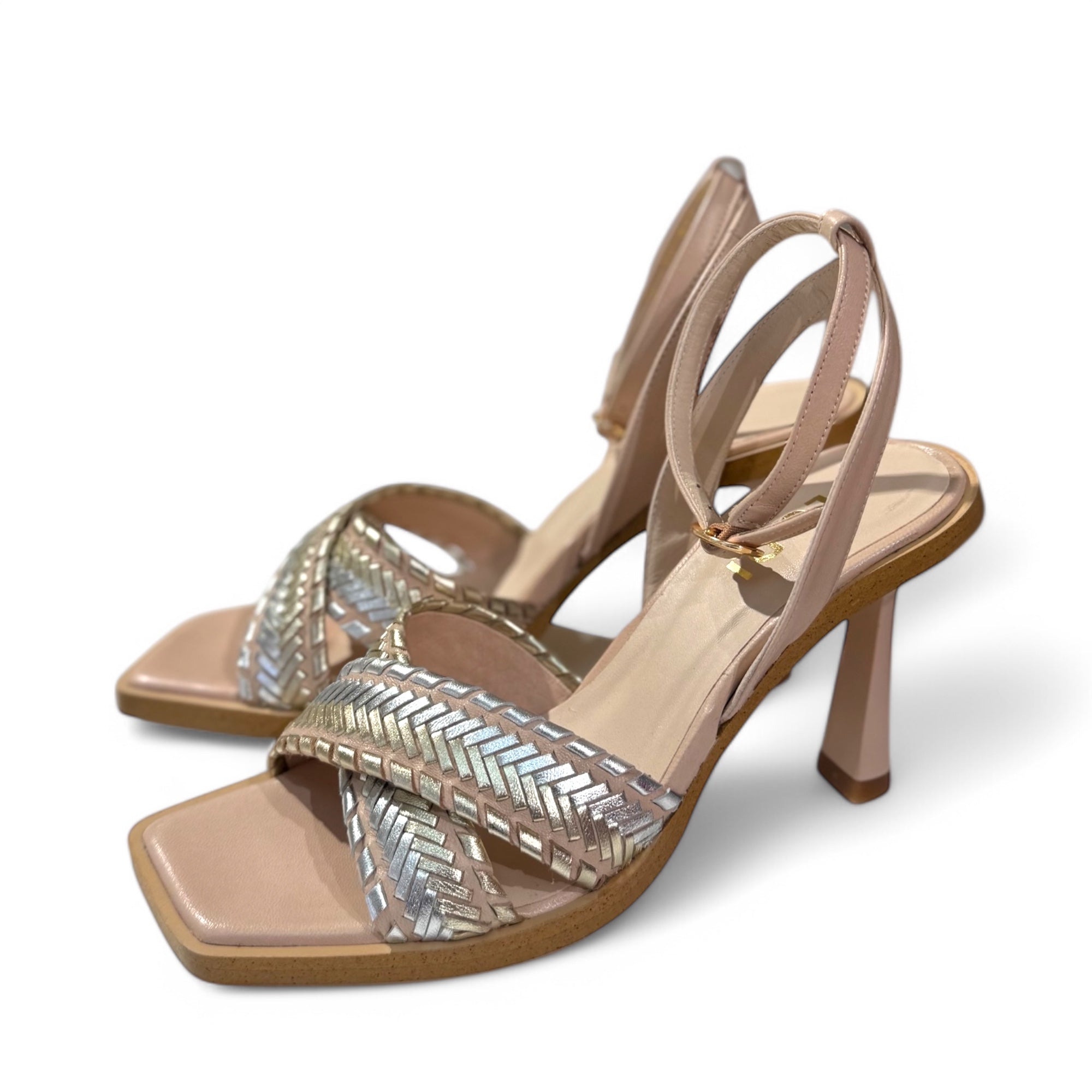 Side angle of Lodi Werune nude heeled sandals with silver and gold woven straps and sculpted heel
