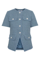 Close-up of pearl button details on Love Lolina Abbot tweed top