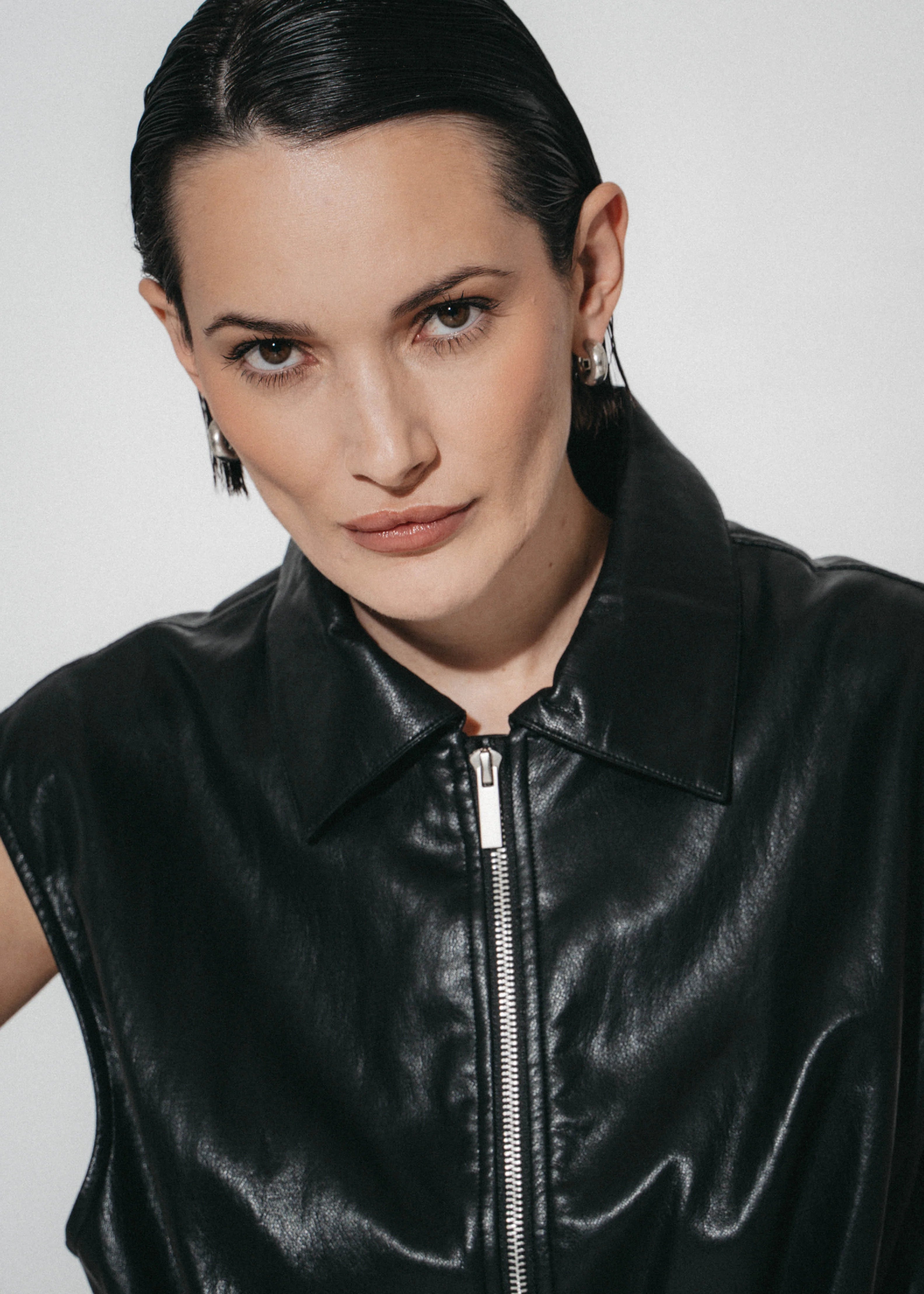 Luje Alora black faux leather sleeveless jacket close-up showing collar and zip