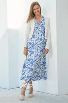 Aspiga cream merino cardigan styled over floral summer dress
