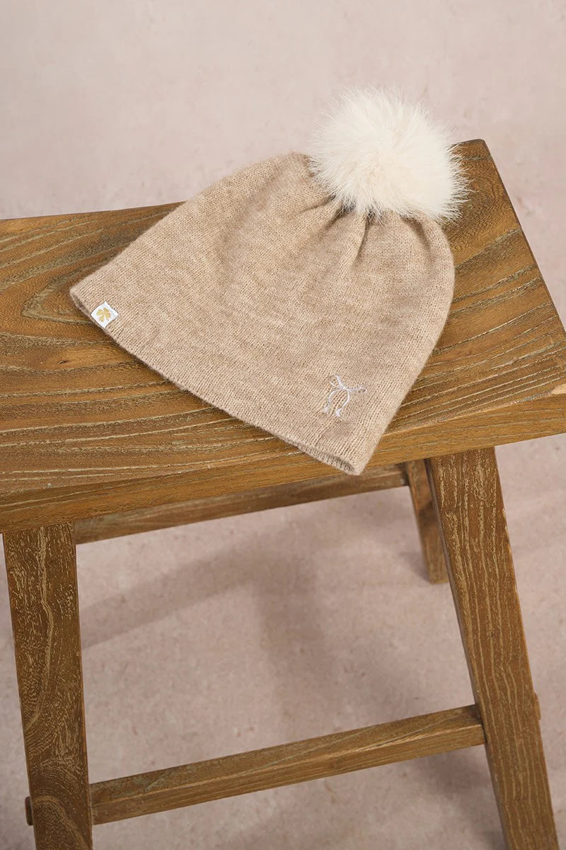 Molly Bracken women’s beige knit beanie with fluffy pom pom and stitched bow