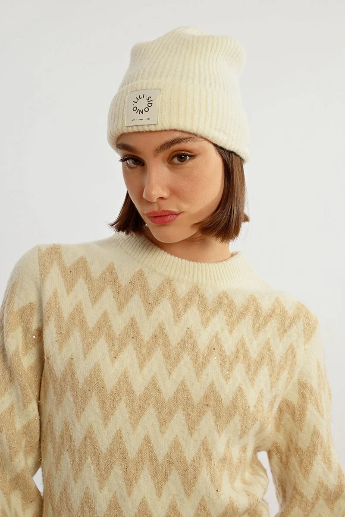 Molly Bracken off-white ribbed knit beanie plain hat on model