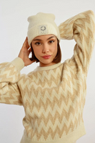 Model wearing Molly Bracken off-white ribbed knit beanie hat with fold over design
