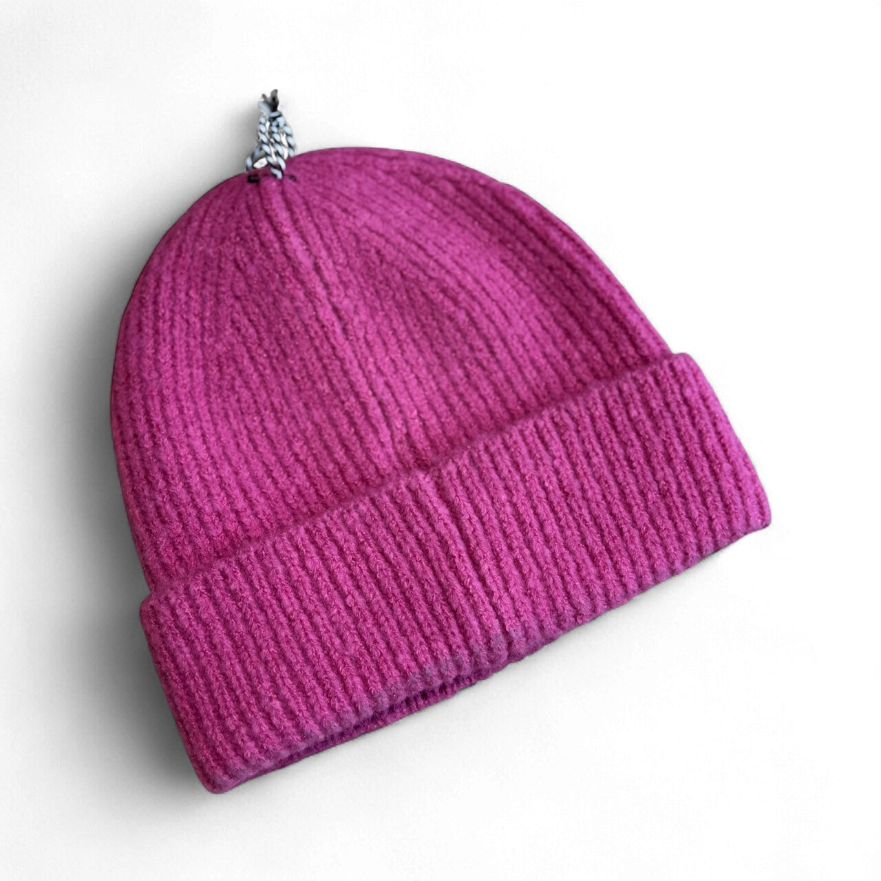 	Rear view of Molly Bracken pink beanie hat for women