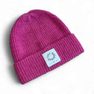 Molly Bracken pink ribbed knit beanie hat with Lili Sidonio branded patch
