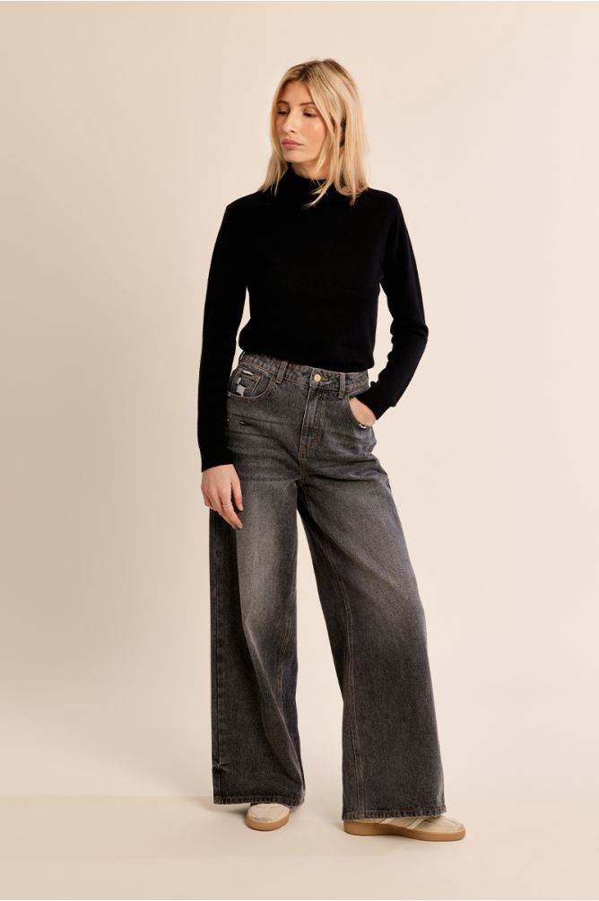 Molly Bracken women’s black high neck knit jumper styled with grey jeans