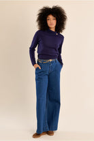 Molly Bracken deep purple fine knit jumper styled with blue trousers