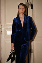 Molly Bracken navy velvet suit styled with pointed heels