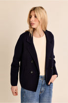 Molly Bracken navy cropped tailored blazer three-quarter view on woman