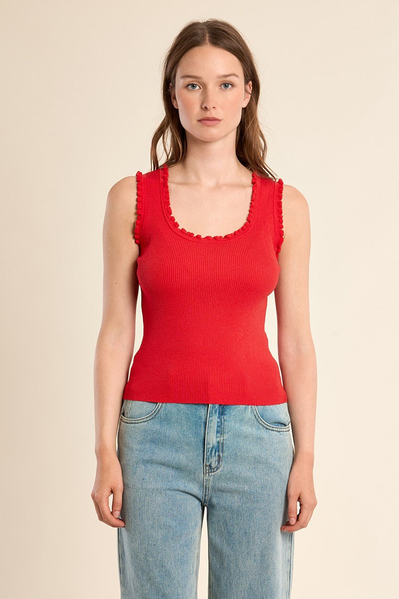 	Molly Bracken red fitted ribbed tank top styled with denim jeans