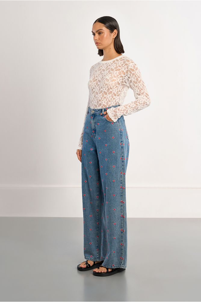 Molly Bracken heart embroidered wide leg jeans side view on model