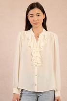 Molly Bracken cream ruffle blouse front view on model